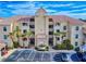 Condo building with parking and fountain at 434 Bouchelle Dr # 202, New Smyrna Beach, FL 32169