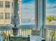 Enclosed balcony overlooking the water, bridge and city skyline at 434 Bouchelle Dr # 202, New Smyrna Beach, FL 32169