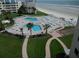 Aerial view of resort pool, shuffleboard, and beach access at 4501 S Atlantic Ave # 5180, New Smyrna Beach, FL 32169