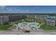 Aerial view of condo complex with pools, beach access, and recreational areas at 4501 S Atlantic Ave # 5180, New Smyrna Beach, FL 32169