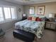 Main bedroom with king-size bed and tropical decor at 4501 S Atlantic Ave # 5180, New Smyrna Beach, FL 32169