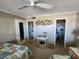 Bedroom with twin beds, adjacent bathroom, and closet at 4501 S Atlantic Ave # 5180, New Smyrna Beach, FL 32169