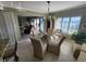 Dining area with glass table, ocean view, and kitchen access at 4501 S Atlantic Ave # 5180, New Smyrna Beach, FL 32169