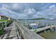 Waterfront dock with boat slips and stunning views of the surrounding water and community buildings at 456 Bouchelle Dr # 202, New Smyrna Beach, FL 32169