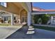 Welcoming entrance to Bouchelle Island with a covered entryway, lush greenery, and inviting doors at 456 Bouchelle Dr # 202, New Smyrna Beach, FL 32169