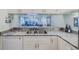 Kitchen area featuring granite countertops and stainless steel sink at 456 Bouchelle Dr # 202, New Smyrna Beach, FL 32169