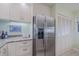 Kitchen featuring stainless steel refrigerator and granite countertops at 456 Bouchelle Dr # 202, New Smyrna Beach, FL 32169