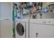 Well-organized laundry room with washer, dryer, shelving, and ample storage space at 456 Bouchelle Dr # 202, New Smyrna Beach, FL 32169