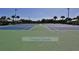 Community tennis courts are immaculately maintained with lush landscaping at 456 Bouchelle Dr # 202, New Smyrna Beach, FL 32169