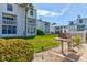 Community backyard with grill and grassy area at 4590 S Atlantic Ave # 258A, Ponce Inlet, FL 32127