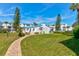 Landscaped grounds with brick pathway and community building at 4590 S Atlantic Ave # 258A, Ponce Inlet, FL 32127