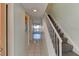 Bright condo entryway with tiled floors and staircase at 4590 S Atlantic Ave # 258A, Ponce Inlet, FL 32127