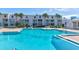 Inviting community pool with surrounding lounge chairs at 4590 S Atlantic Ave # 258A, Ponce Inlet, FL 32127