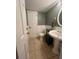 Clean bathroom with pedestal sink and tile floor at 472 Wildwood Dr, New Smyrna Beach, FL 32168