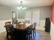 Bright dining room with a large table and chandelier at 472 Wildwood Dr, New Smyrna Beach, FL 32168