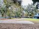 Long driveway leading to a house and garage at 472 Wildwood Dr, New Smyrna Beach, FL 32168