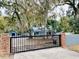 Automatic gate entrance to the property at 472 Wildwood Dr, New Smyrna Beach, FL 32168