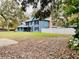 Side view of the house showing the backyard at 472 Wildwood Dr, New Smyrna Beach, FL 32168