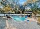 Inviting pool area with patio, gazebo, and grilling station at 472 Wildwood Dr, New Smyrna Beach, FL 32168