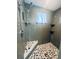 Large walk-in shower with pebble floor and tile surround at 472 Wildwood Dr, New Smyrna Beach, FL 32168