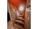 Elegant wooden staircase leading to the upper level at 472 Wildwood Dr, New Smyrna Beach, FL 32168