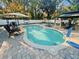 Inviting kidney-shaped pool with patio furniture at 472 Wildwood Dr, New Smyrna Beach, FL 32168