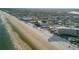 Wide aerial showcasing the expansive beach and community at 505 N Atlantic Ave # 29, New Smyrna Beach, FL 32169