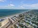 Aerial view of beachfront property with ocean and residential areas at 505 N Atlantic Ave # 29, New Smyrna Beach, FL 32169