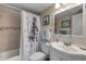 Bathroom with shower/tub combo and updated vanity at 505 N Atlantic Ave # 29, New Smyrna Beach, FL 32169