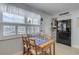 Cozy kitchen dining area with table and chairs near window at 505 N Atlantic Ave # 29, New Smyrna Beach, FL 32169