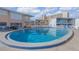 Inviting kidney-shaped pool with surrounding lounge chairs at 505 N Atlantic Ave # 29, New Smyrna Beach, FL 32169