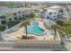 Relaxing kidney-shaped pool with surrounding patio at 505 N Atlantic Ave # 29, New Smyrna Beach, FL 32169