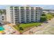 Aerial view of beachfront condo building with pool and beach access at 5203 S Atlantic Ave # 412B, New Smyrna Beach, FL 32169