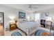 King-size bed, wooden furniture, and ocean-themed decor at 5203 S Atlantic Ave # 412B, New Smyrna Beach, FL 32169