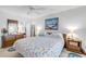 King-size bed, wooden furniture, and ocean-themed decor at 5203 S Atlantic Ave # 412B, New Smyrna Beach, FL 32169