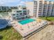 Oceanfront pool with lounge chairs and patio tables at 5203 S Atlantic Ave # 412B, New Smyrna Beach, FL 32169