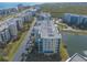 Aerial view showcasing building and surrounding area at 5300 S Atlantic Ave # 15-401, New Smyrna Beach, FL 32169