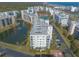 Aerial showing condo building and resort-style amenities at 5300 S Atlantic Ave # 15-401, New Smyrna Beach, FL 32169