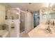 Bathroom with double sinks, shower, and tub at 5300 S Atlantic Ave # 15-401, New Smyrna Beach, FL 32169