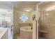 Spa-like bathroom with corner tub and walk-in shower at 5300 S Atlantic Ave # 15-401, New Smyrna Beach, FL 32169