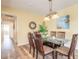 Bright dining room featuring a glass table and wood chairs at 5300 S Atlantic Ave # 15-401, New Smyrna Beach, FL 32169