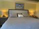 Bedroom featuring a king bed, lamps, and nightstands at 5300 S Atlantic Ave # 5-206, New Smyrna Beach, FL 32169