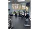 Community gym features modern treadmills, stationary bikes, and large windows offering views at 5300 S Atlantic Ave # 5-206, New Smyrna Beach, FL 32169