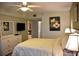 Spacious bedroom with a queen bed and ensuite bathroom access at 5300 S Atlantic Ave # 8-302, New Smyrna Beach, FL 32169