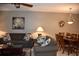 Combined living and dining area, featuring brown sofas and wooden dining set at 5300 S Atlantic Ave # 8-302, New Smyrna Beach, FL 32169