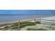 Oceanfront property with beach access and wooden fence at 541 S Peninsula Ave # A03, New Smyrna Beach, FL 32169