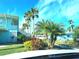 Building exterior showcasing landscaping and palm trees at 541 S Peninsula Ave # A03, New Smyrna Beach, FL 32169