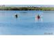 Two people kayaking in calm water at 541 S Peninsula Ave # A03, New Smyrna Beach, FL 32169