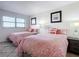 Guest bedroom with two twin beds and ocean view at 5499 S Atlantic Ave # 904, New Smyrna Beach, FL 32169