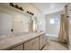 Clean bathroom with vanity, tub, and tiled floor at 608 Magnolia St, New Smyrna Beach, FL 32168